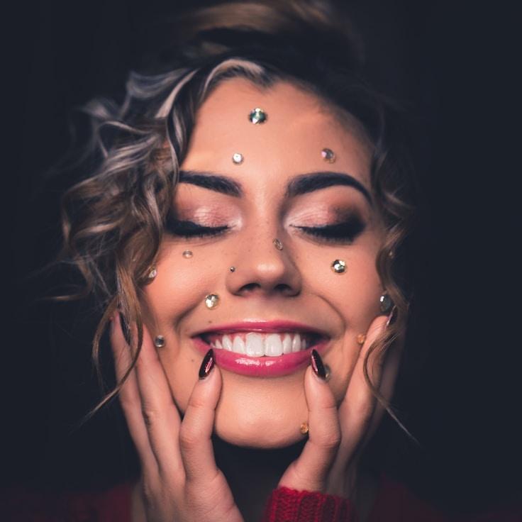 Anya Rao, Lead Design Curator at Sprout Linen Atlas, reviewing corporate floral arrangements